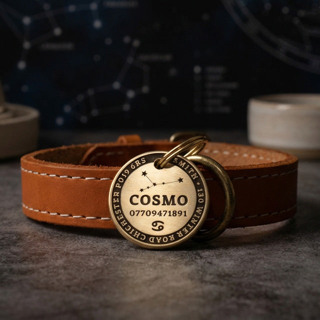 Zodiac Star Sign Brass dog tag featuring the name 'Cosmo' on a dark background.